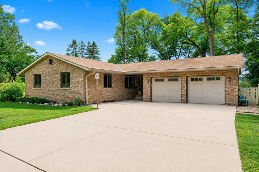 Bright brick home with clean driveway (1).png
