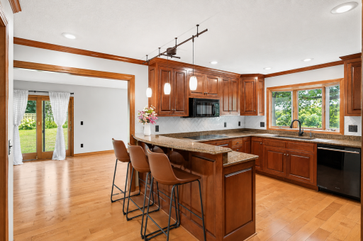 Bright, inviting kitchen and breakfast bar (1).png