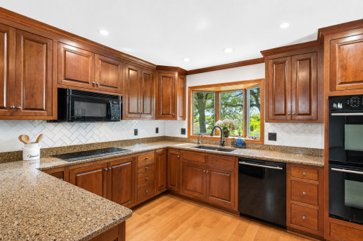 Bright, polished kitchen with cherry cabinetry (1).png