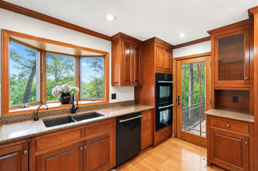Inviting cherry kitchen with back-door view.png