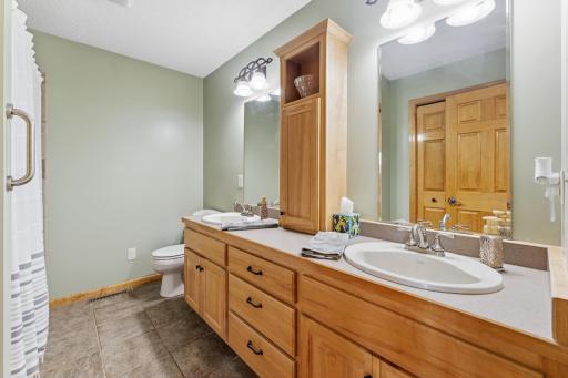main floor full bath with jet tub double sinks