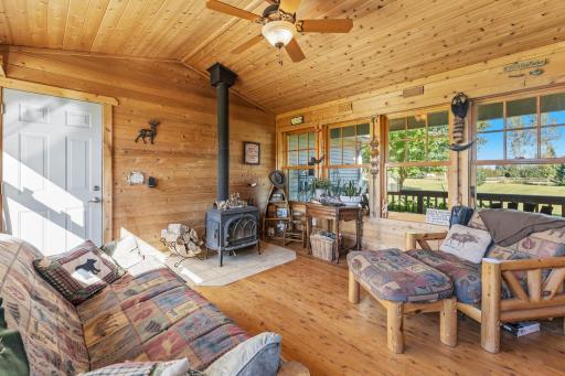 wood stove gives this room a cozy warm feel