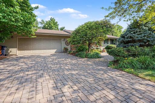 Gorgeous paver driveway, sidewalk, and patio in back, plus, don't miss workshop in garage and oversized wide entrance door, almost 2 feet wider than standard!