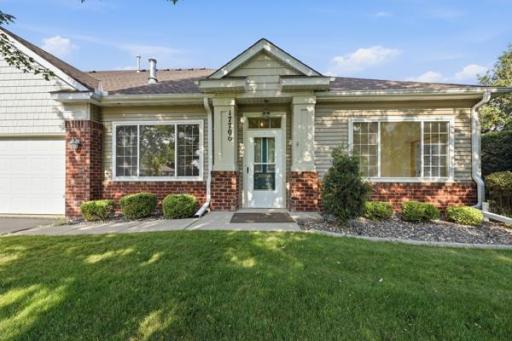 A charming covered entry welcomes you home, complete with craftsman style columns and warm brick detailing. Full window walls flood the front rooms with natural light.