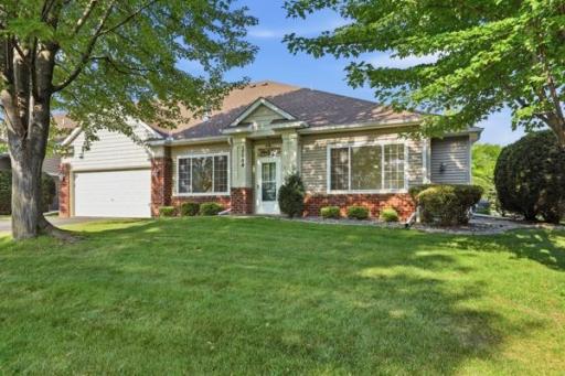 Set back from the street, this ranch style home offers great symmetry between the brick and siding exterior. The manicured shrubs add a nice pop of color along the front.
