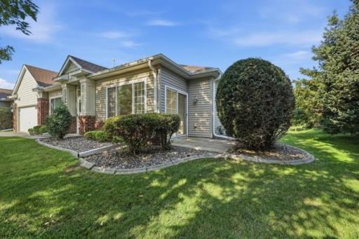 A private concrete patio just off the back of the home is perfect for morning coffee or evening relaxation. Mature landscaping surrounds the space for extra privacy.