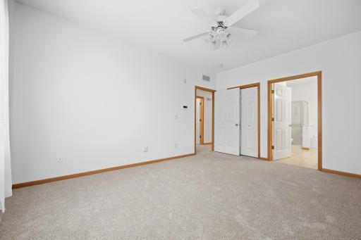 This angle shows the convenient connection between the primary bedroom, walk in closet and en suite bath. A smart layout keeps everything within easy reach.