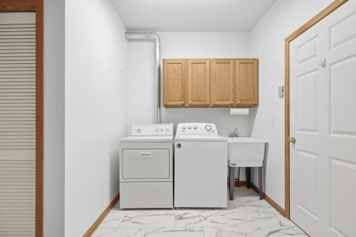 Spacious mud room right off the garage. New flooring, fresh paint and extra room for storage.