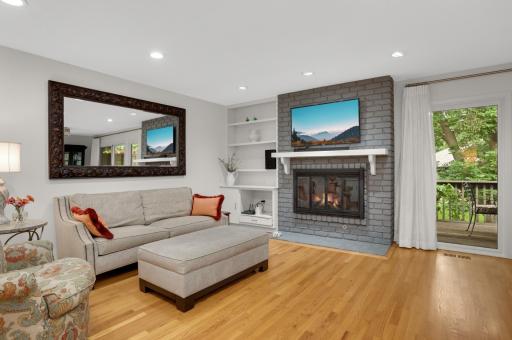 The family room is one of the favorite places in the home; with a gas fireplace and built-ins and a great view out to the deck and outdoors