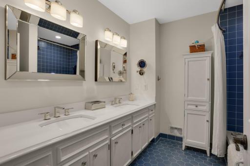 Primary full bathroom with double sinks and a large soaking tub