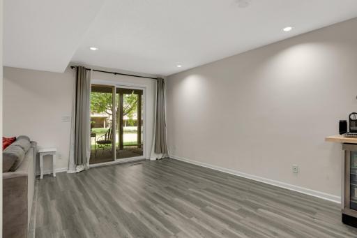 Sliding glass doors walk out to the patio and a lot more living space too