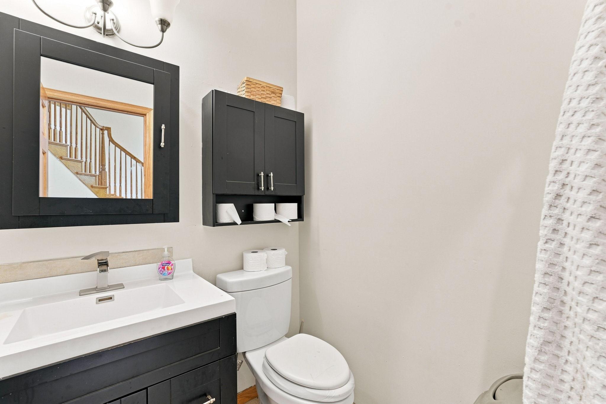 A half bath sits off the front entryway