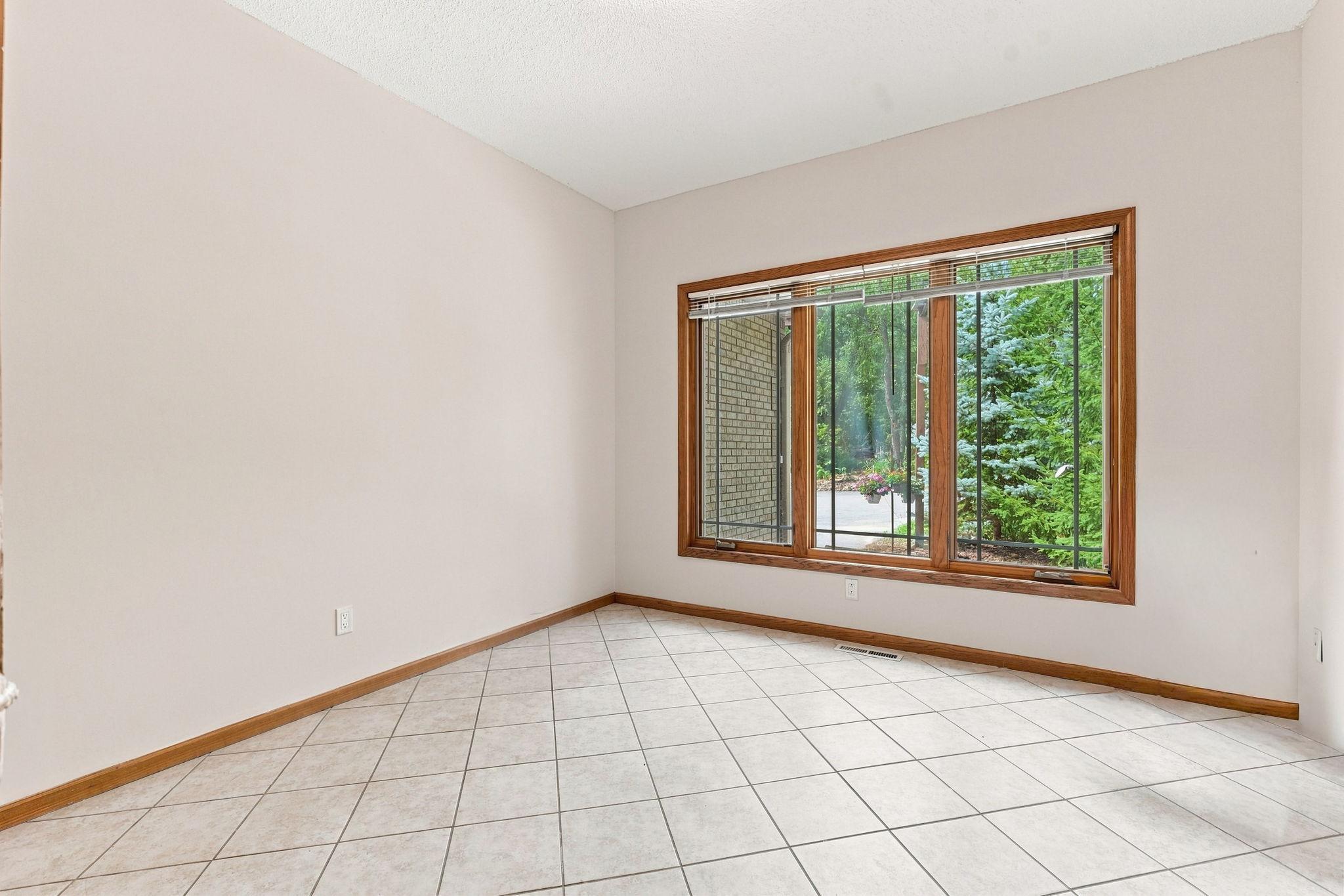 A large space perfect for an office, study or den lies just off the front door.