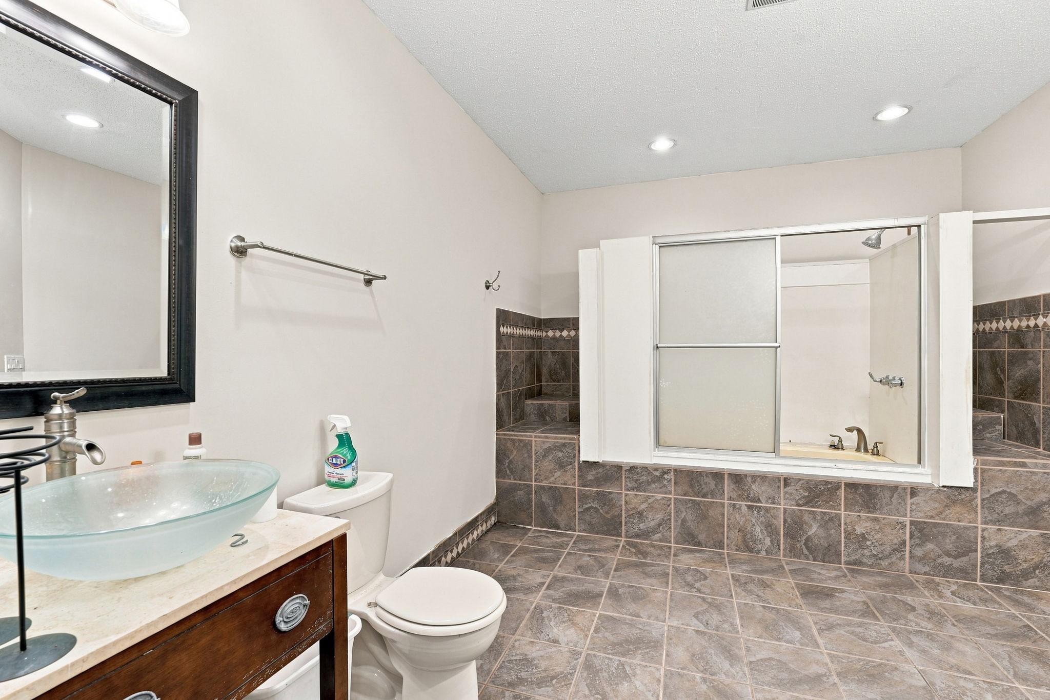 Convenient basement bath with full tub and shower