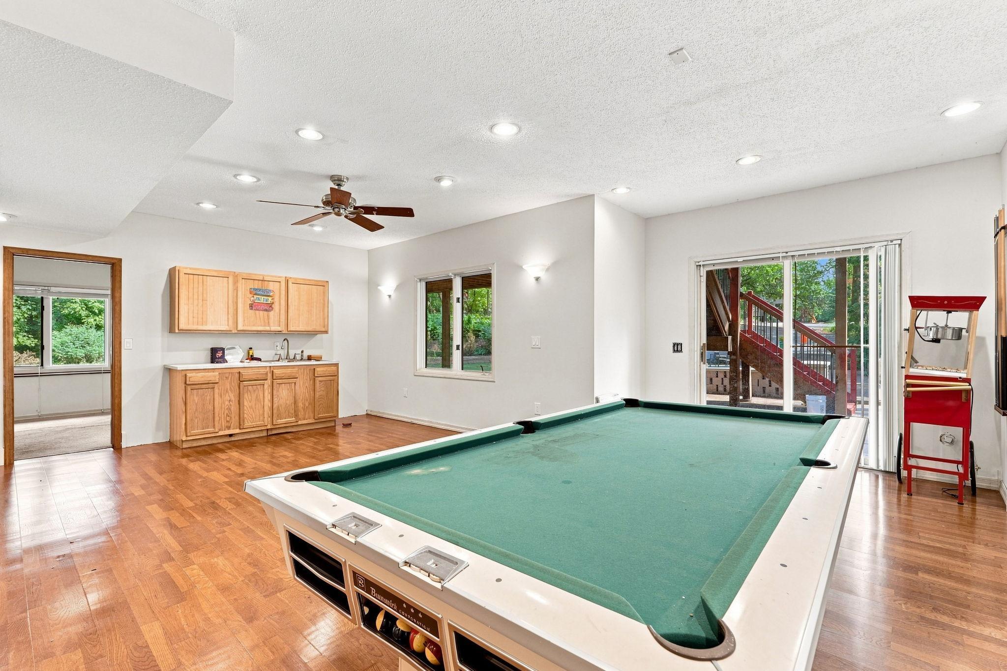 Finished basement space with walkout to porch and yard