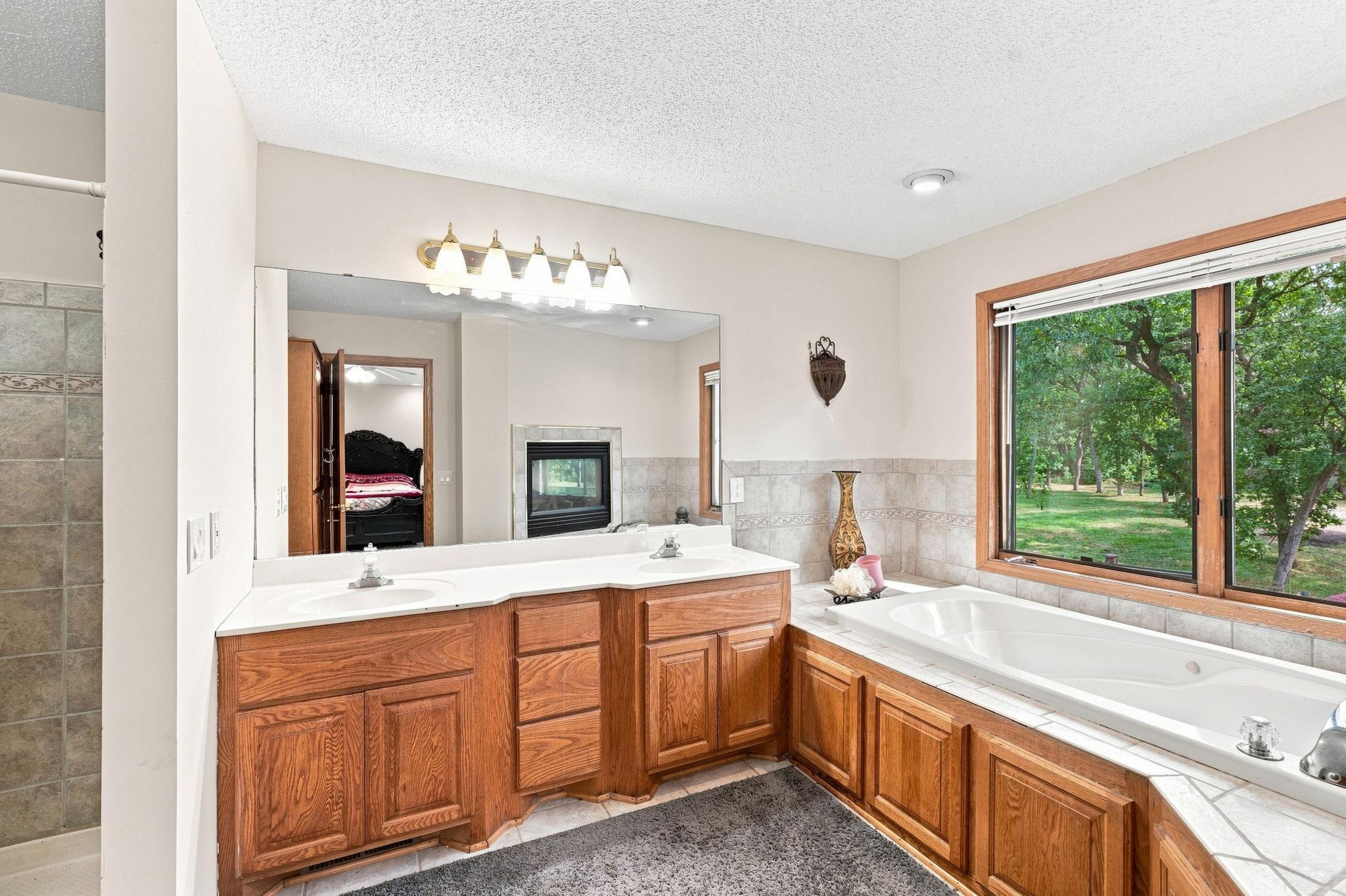 The en-suite bathroom boasts a jetted tub, double sinks and a shower stall