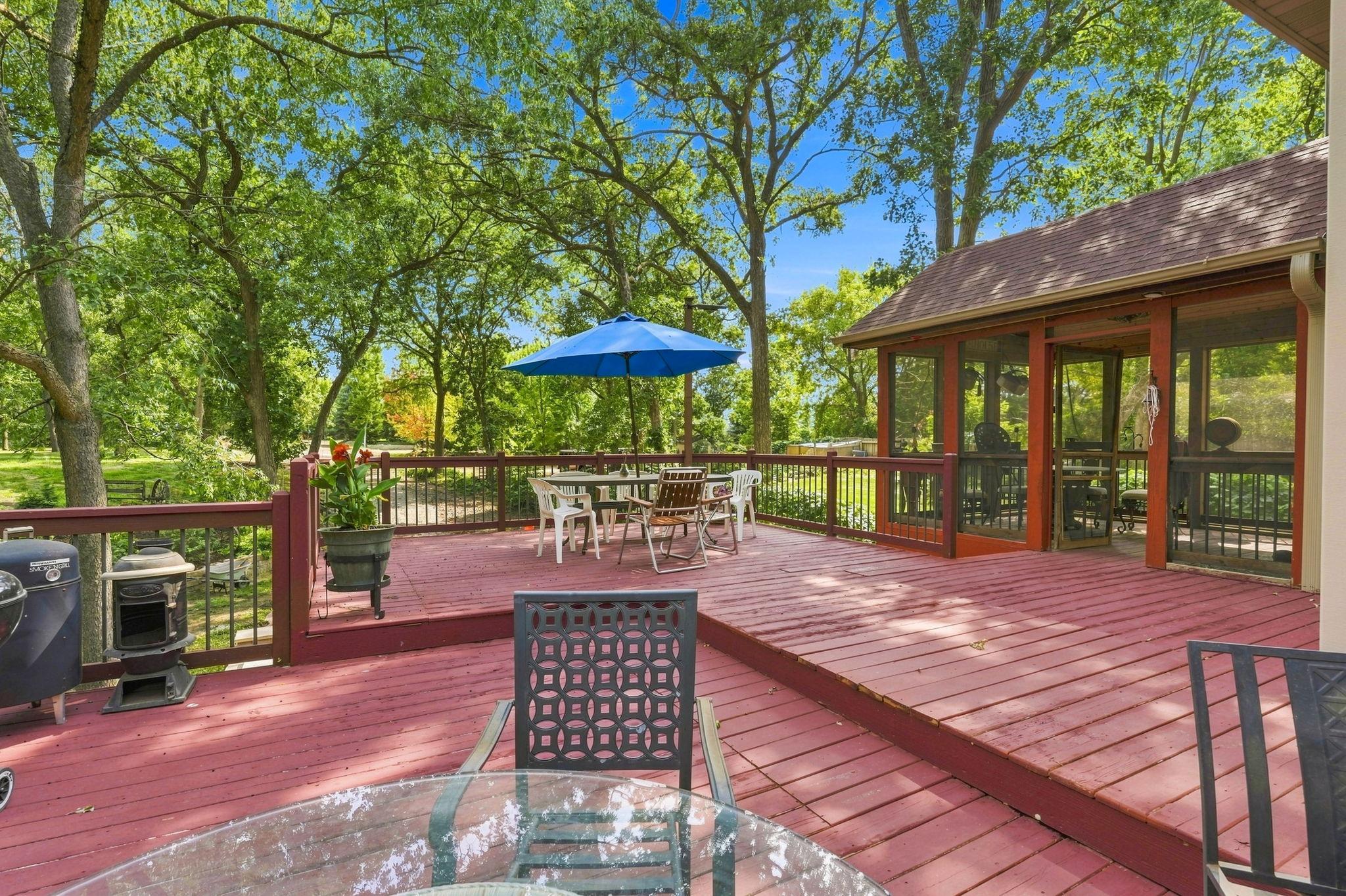 Spacious deck off sunroom with room for multiple seating areas
