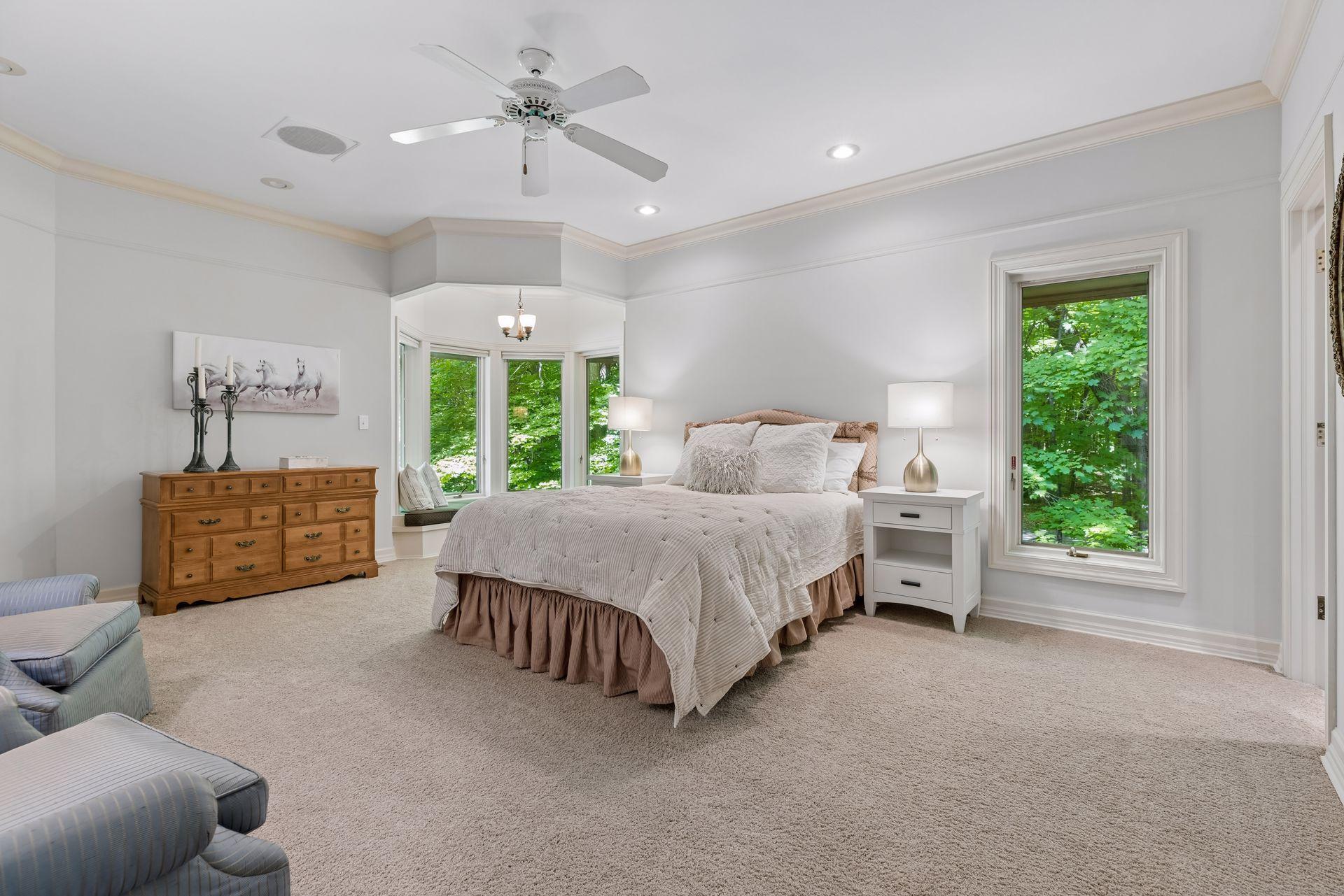 Upper level bedroom with curved window seat