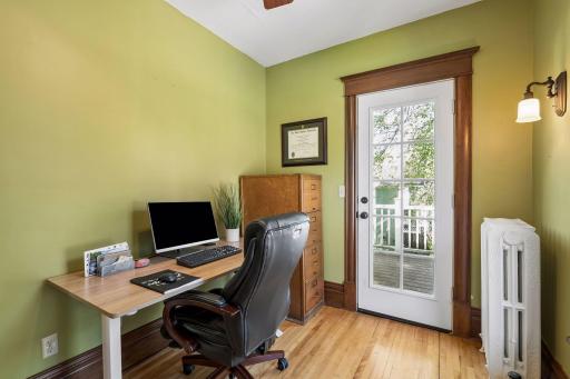The perfect nursery or office with private balcony overlooking the homes backyard.