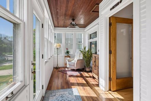 Enjoy the front porch year round! This space was updated to extend your enjoyment - the floor and ceiling both insulated and heat was added.