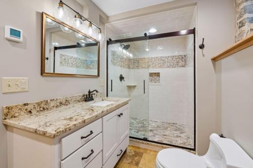 Beautiful spa-like bathroom with oversized walk-in closet.
