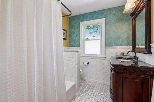 Remodeled upper level full bathroom with heated floors.