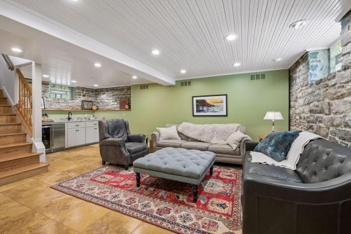 The finished lower level space boasts heated tile flooring throughout.