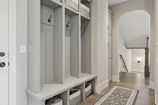 The homes mudroom is just off the attached and heated 3 car garage.