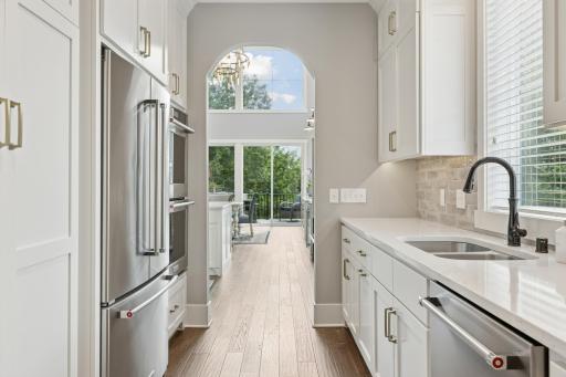 Just off the kitchen sits the perfect prep space complete with double wall oven, a full size refrigerator, second main floor dishwasher, tons of pantry space and so much more.
