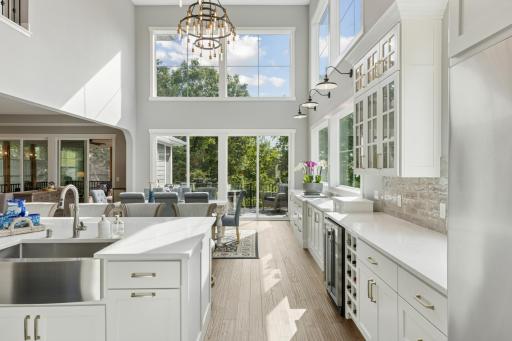 Let the light flood in! Soaring windows and vaulted ceiling make this the most elegant space.