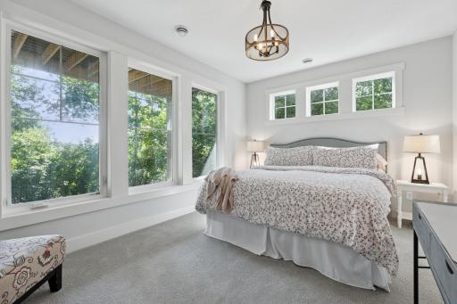 Perfect lower level guest bedroom with a wall of windows!
