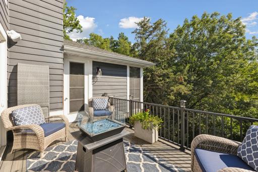 Back yard deck offers a gas firepit and gas grill.
