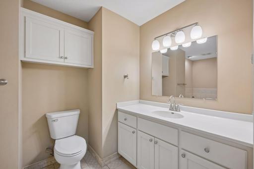 Main floor bathroom features whirlpool tub, separate shower & tile floors and stackable washer & dryer.