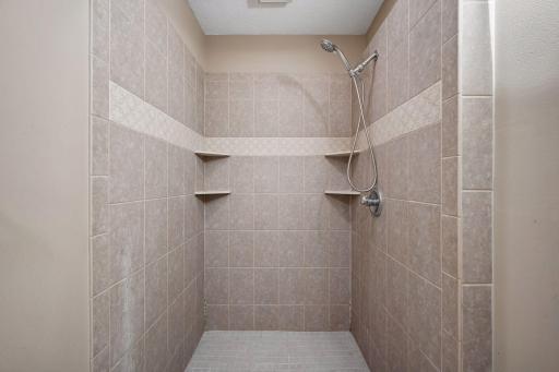 Ceramic tile shower in main bathroom.