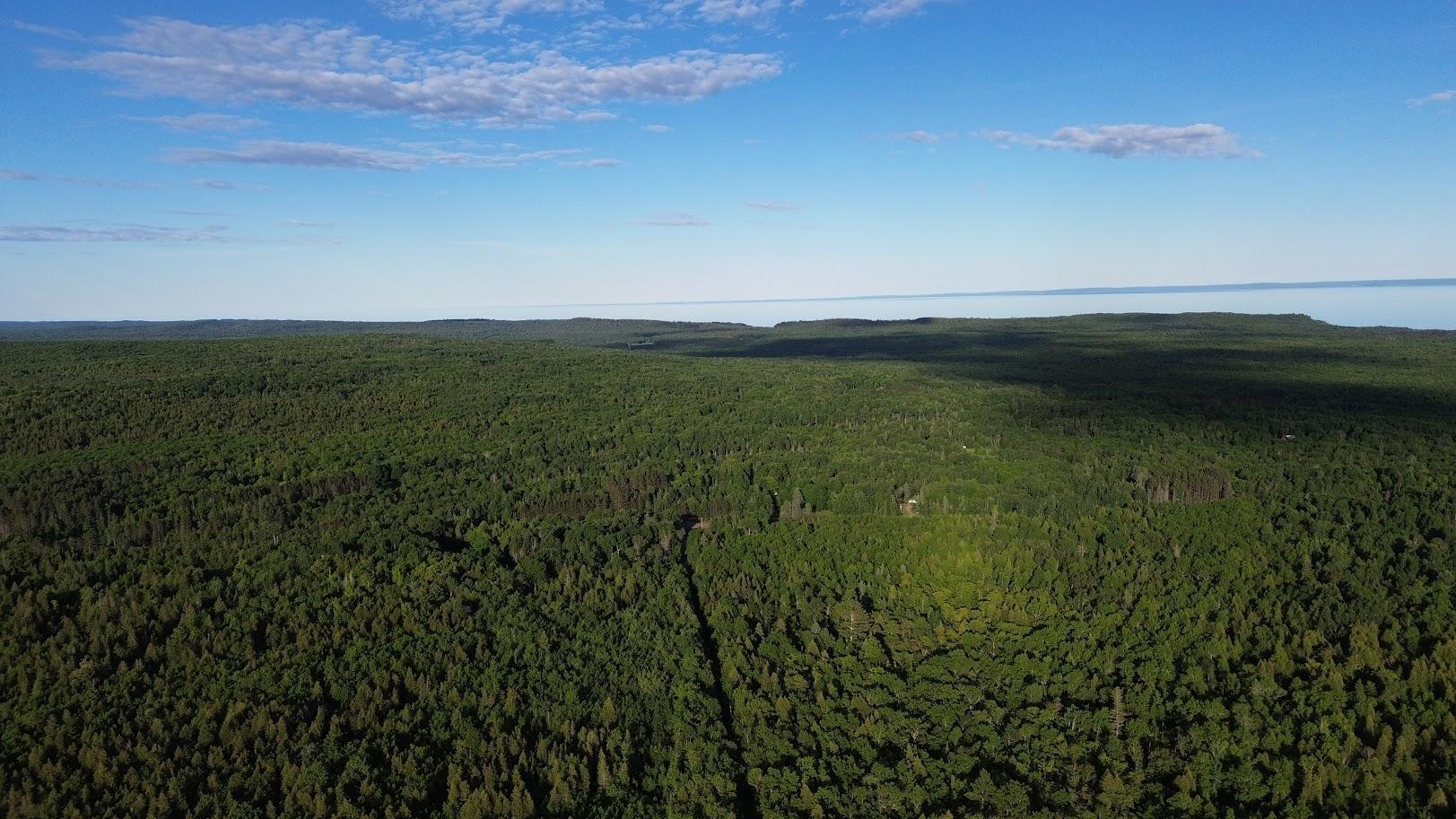 The property's elevated location provides a stunning approach toward Lake Superior.