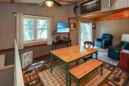 Dining and kitchen area with a patio door leading to the deck.jpg