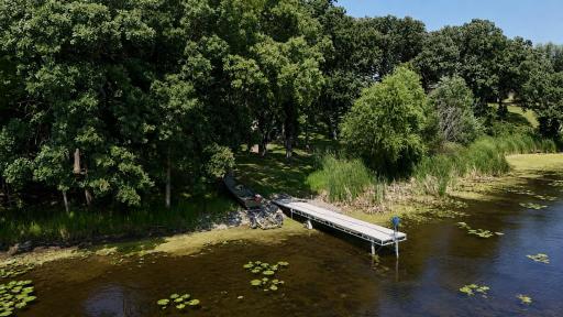 View from the lake to the dock and backyard.JPG