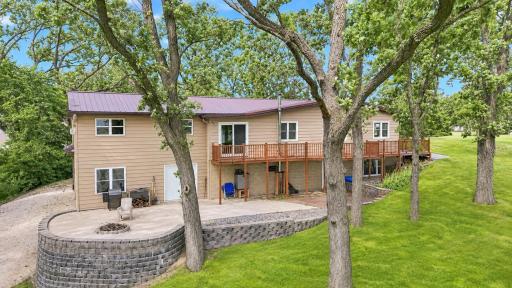 Back of the home with a huge patio and wrap around deck.jpg