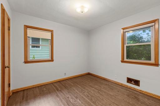 Second bedroom of the main level with backyard and side views.