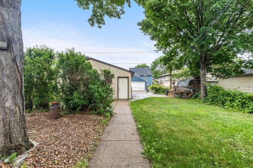 Walkway extending through the back yard for easy access to the patio and garage.