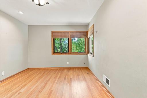 Oak floors and a large closet make this a peaceful room.