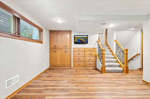 The lower level Den was renovated in 2021 with new flooring, built in storage and new stair railings. This level offers daylight views through the windows.
