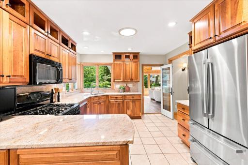 Gorgeous American Cherry cabinetry and cream colored granite countertops make this kitchen shine!