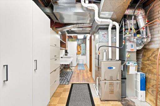 This utility room is neat with all mechanicals updated in 2021 or newer.