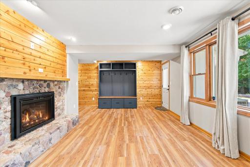 The entry from the garage is to the left of the custom made coat lockers.