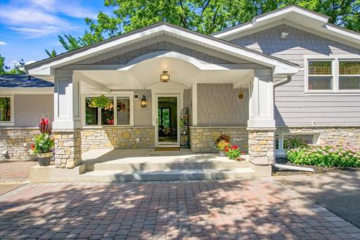 The grand covered front porch with its craftsman style columns welcomes guests in style!
