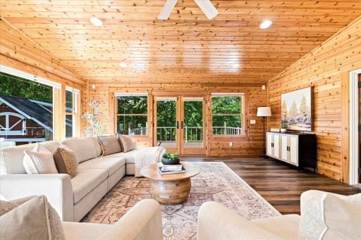 The pine Tongue and Groove is warm and cozy with views of the magical wooded property from three sides