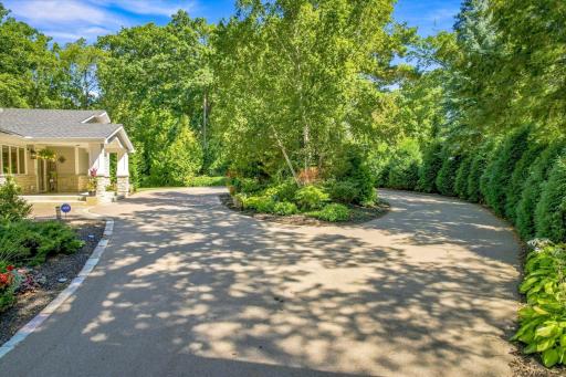 The circular drive brings you around the garden to the front entry