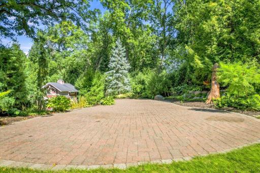 One of 7 paver patios throughout the property - 50' x 22' Surrounded by pines and lush trees for privacy.