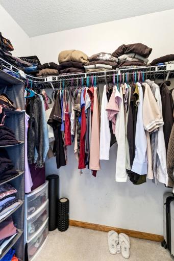 Walk-in closet in the primary bedroom.